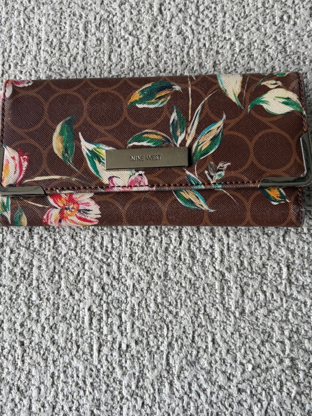 Nine West brown, floral bi-fold wallet.